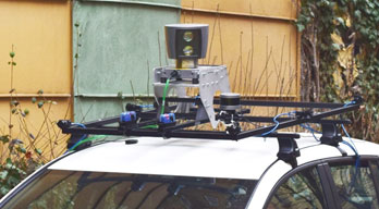 Figure 1: A host of image and range sensors are mounted onto the electric test car.