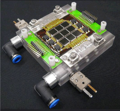 Figure 1: Lab demonstration of a nine-cell, water-cooled photovoltaic receiver module