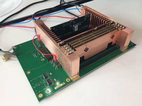 Figure 3: Microserver cluster demonstrator. Cooling water is delivered to the stack of cards via the manifolds on the left- and right-hand sides.