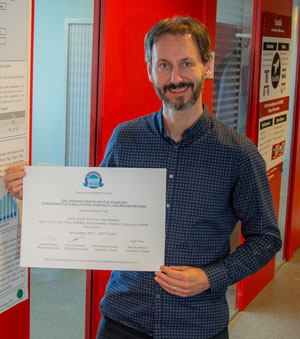Marten van Dijk at CWI with the 2023 ACM SIGSAC CCS Test of Time Award certificate.