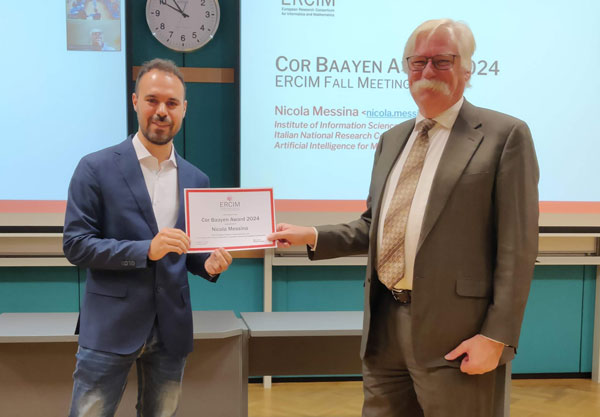 Nicola Messina (left) receives the Cor Baayen Award from ERCIM President Björn Levin at the ERCIM Fall Meetings in Budapest on 16 October 2024.