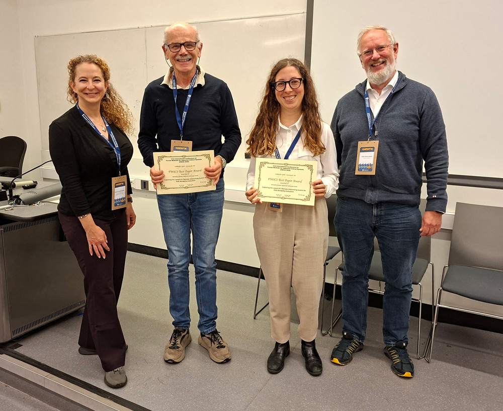Alessandro Fantechi and Gloria Gori received their FMICS 2026 Best Paper Award from the PC chairs Kristin Yvonne Rozier and Peter Gorm Larsen.