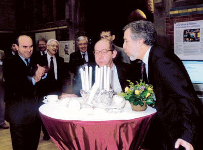 ERCIM celebrated its 10th anniversary in Amsterdam in November 1999. ERCIM president Gerard van Oortmerssen (center) and Stelios Orphanoudakis who succeeded him as president in 2004, are blowing the candles. Sadly, due to illness, Stelios presidency was all too short. ERCIM celebrated its 10th anniversary in Amsterdam in November 1999. ERCIM president Gerard van Oortmerssen (center) and Stelios Orphanoudakis who succeeded him as president in 2004, are blowing the candles. Sadly, due to illness, Stelios presidency was all too short.