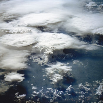 Convection in cumulus clouds is the major source of vertical transport of heat and moisture in the atmosphere. Reflection and absorption of solar radiation by clouds is important for the global heat balance. Explicit modelling of convection requires 50 metres model resolution, whereas global atmosphere models used in climate science have resolutions of 100 kilometres and more. (Image by NASA-JSC).