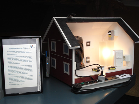 The smart house demo setup with a mini-PC for controlling lighting and heating.