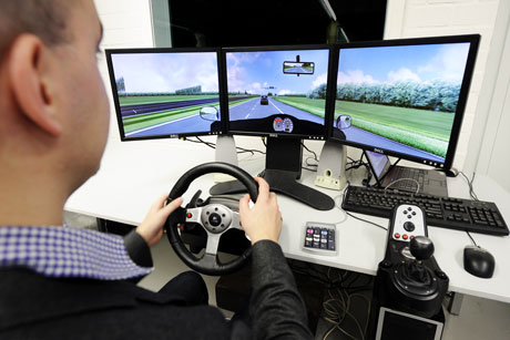 Figure 1: PhD student Frank Verberne testing a driving simulator for future experiments (photo: Bart van Overbeeke).